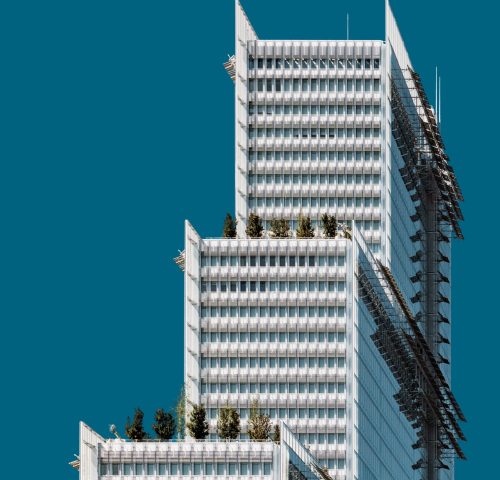A vertical shot of a beautiful white building under the blue sky