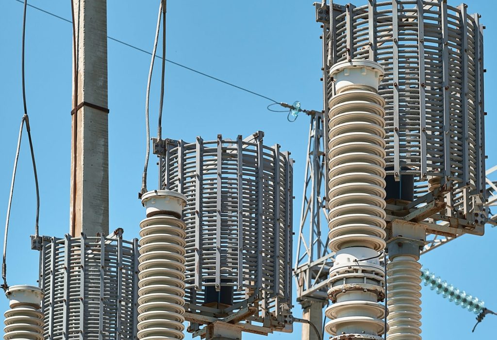High voltage electrical transformers in an electricity distribution power plant. Close-up