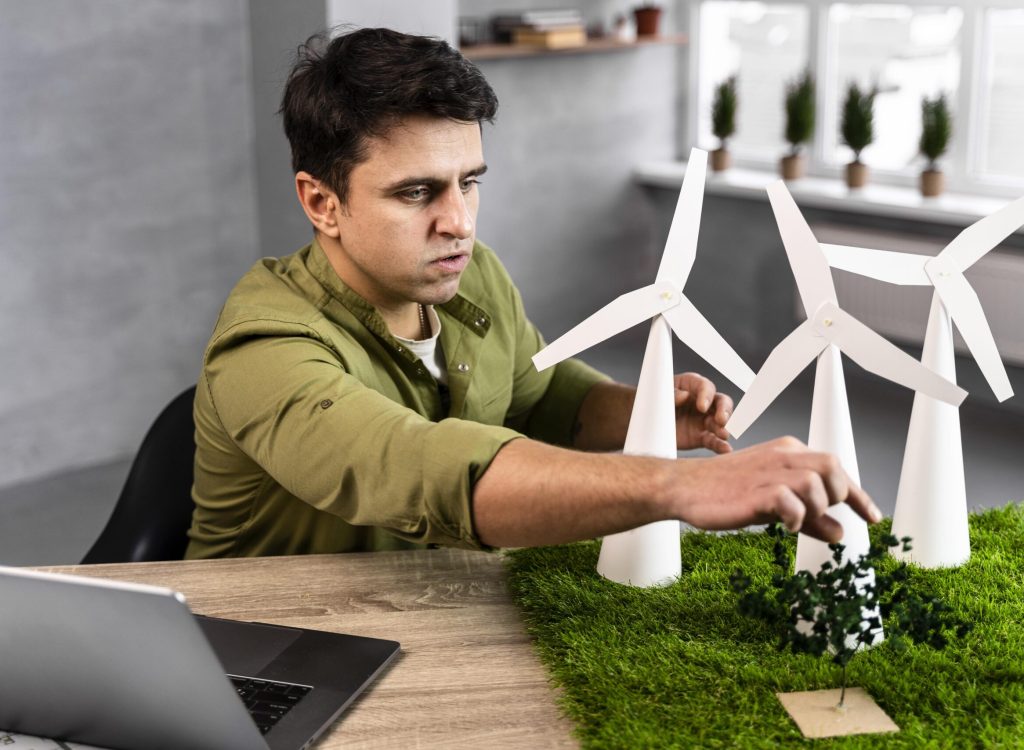 man-working-eco-friendly-wind-power-project-with-wind-turbines